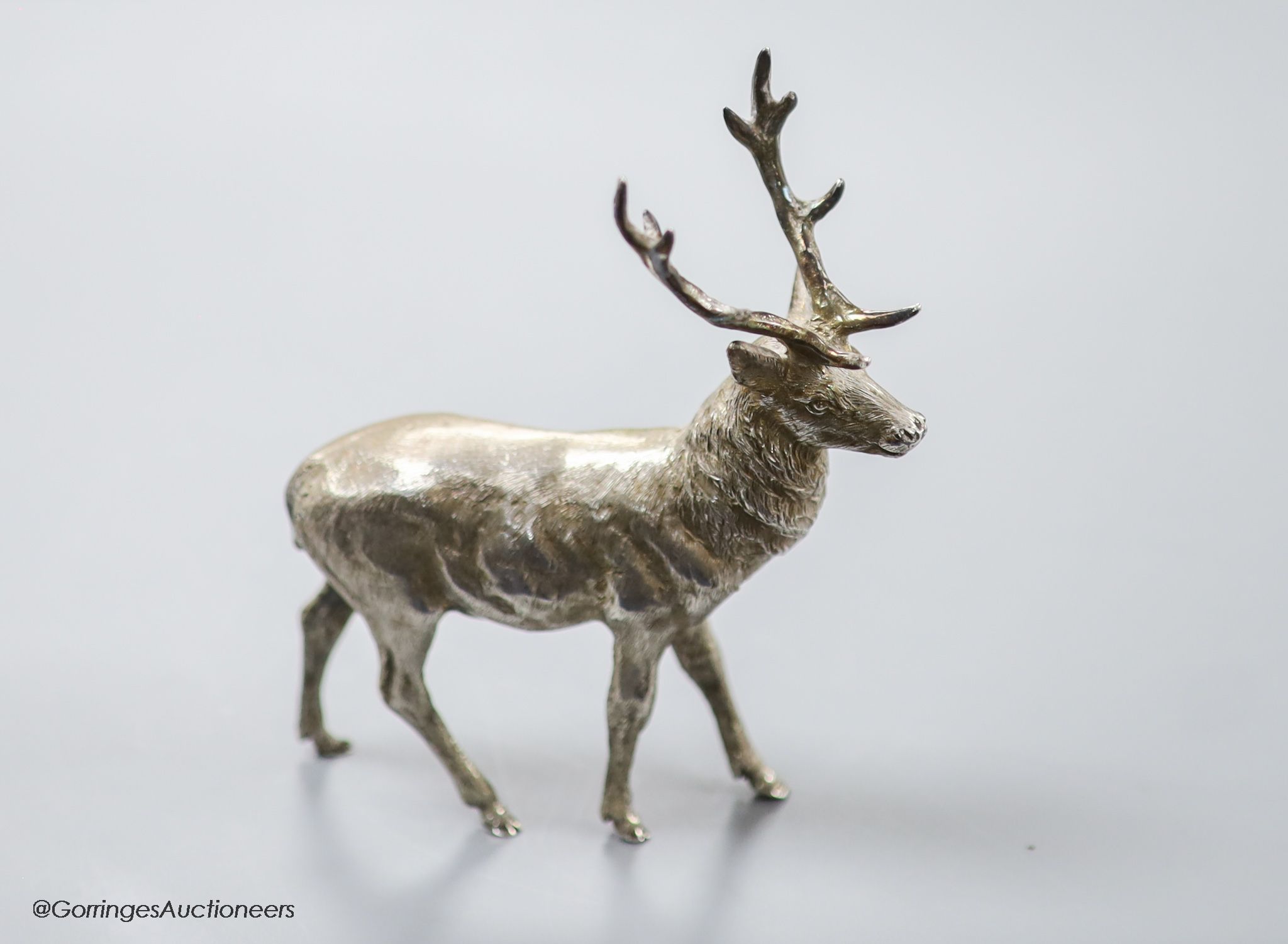 A modern free standing silver miniature model of a stag, C.F.H & Co, London, 1990, height 10.9cm, 162 grams.